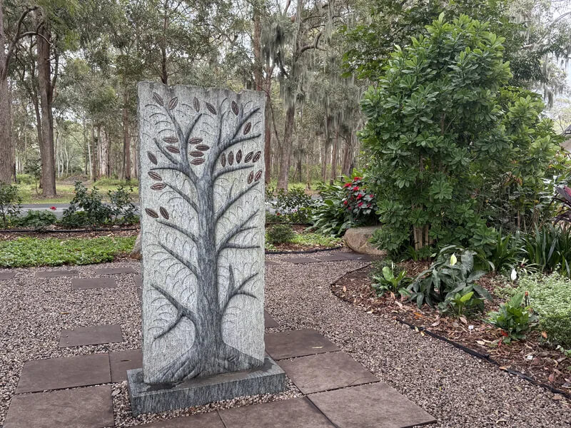 Close View of the Carved Memorial Stone Close view of the carved branching design of the memorial stone with its engraved leaf plaques`