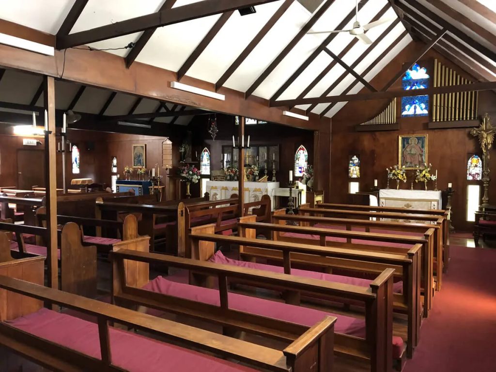 heritage-chapel-interior Heritage chapel interior with timber pews and stained glass