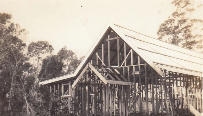 The timber frame and roof of the original Abbey Church under construction.