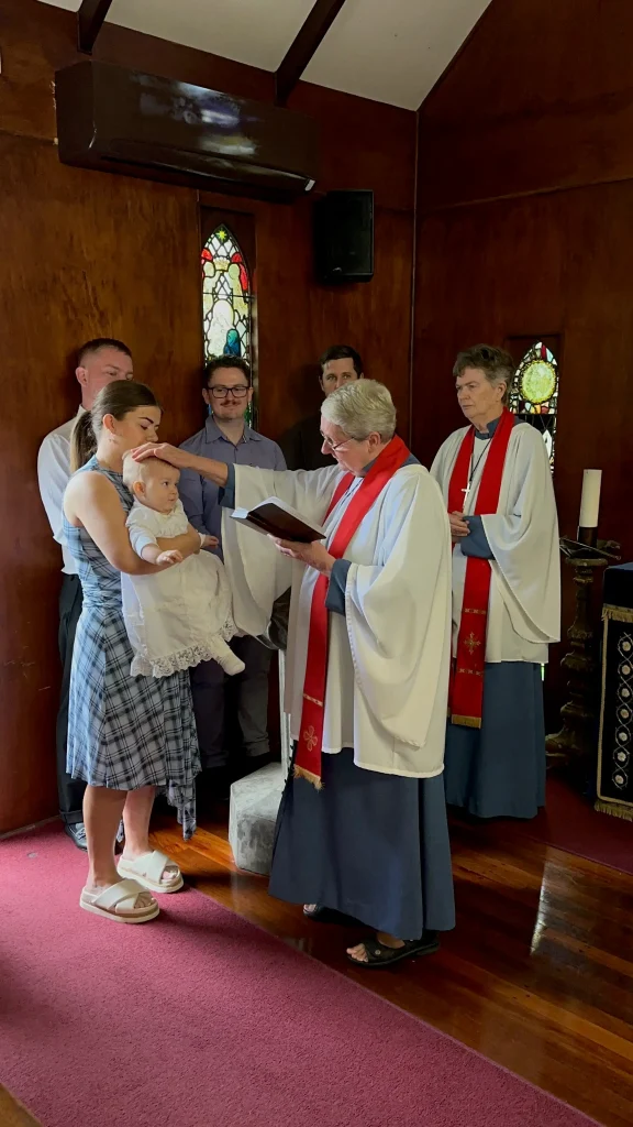 abbey-church-baptism-ceremony-2 Family and clergy during a baptism ceremony at The Abbey Church