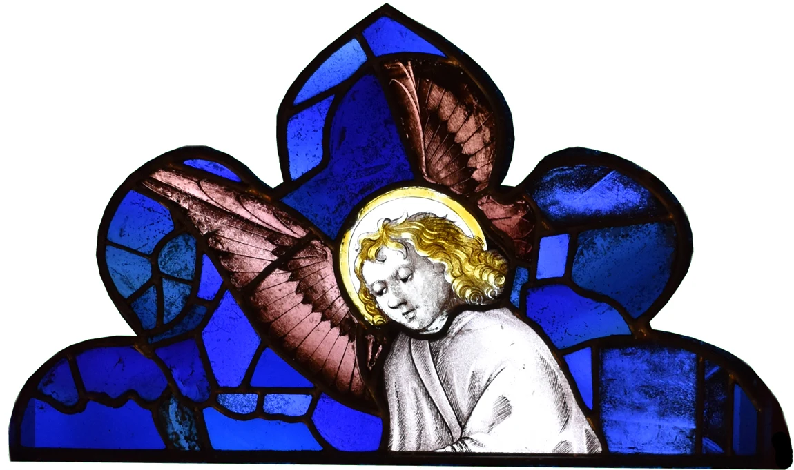 Detail of an angel's head in stained glass at The Abbey Church